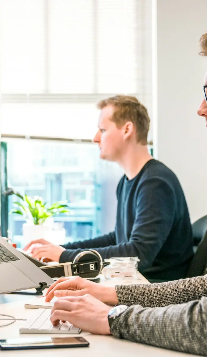 Professional technology and business team collaborating in a modern office